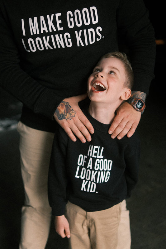 Dad and child in matching black sweatshirts